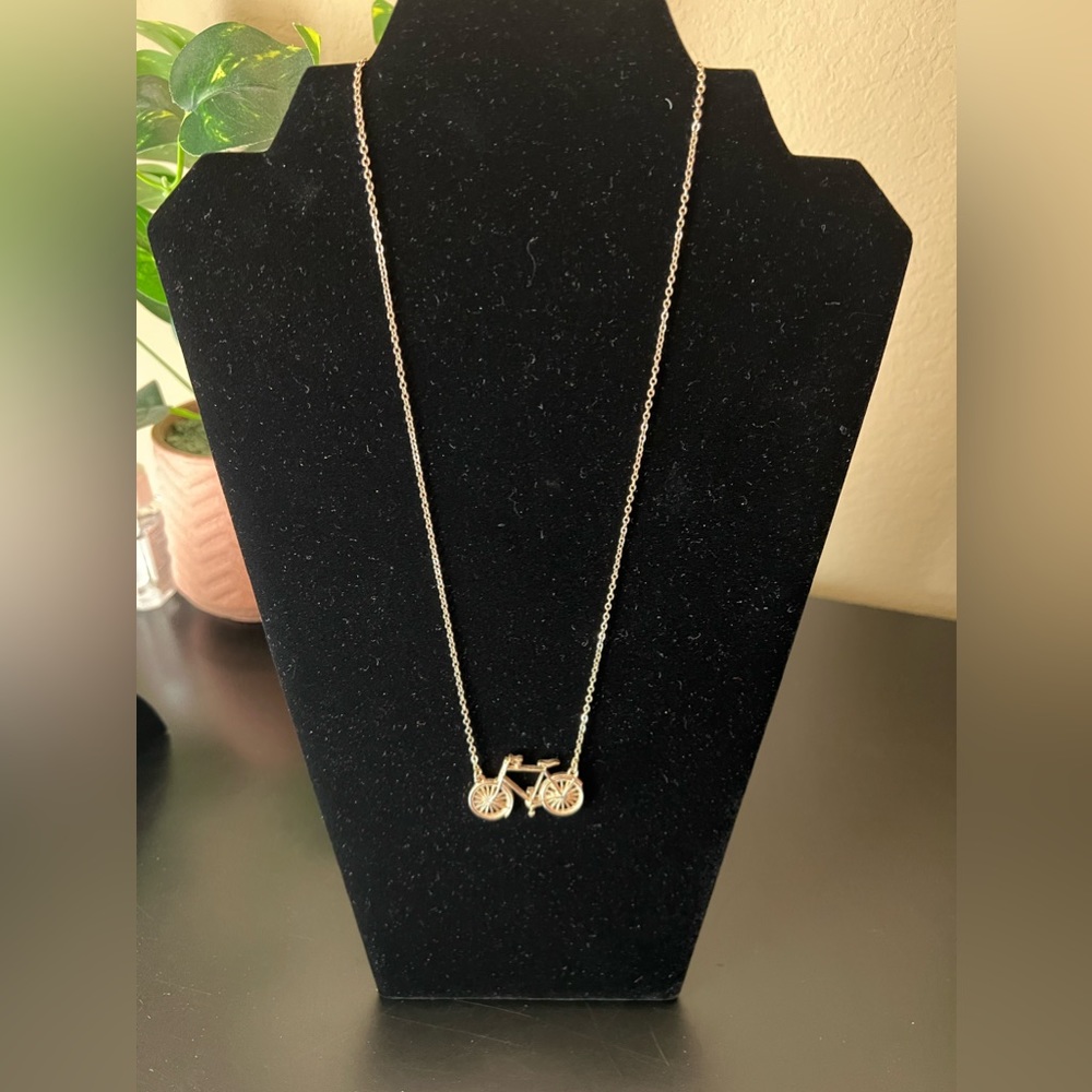 Gold colored bicycle necklace